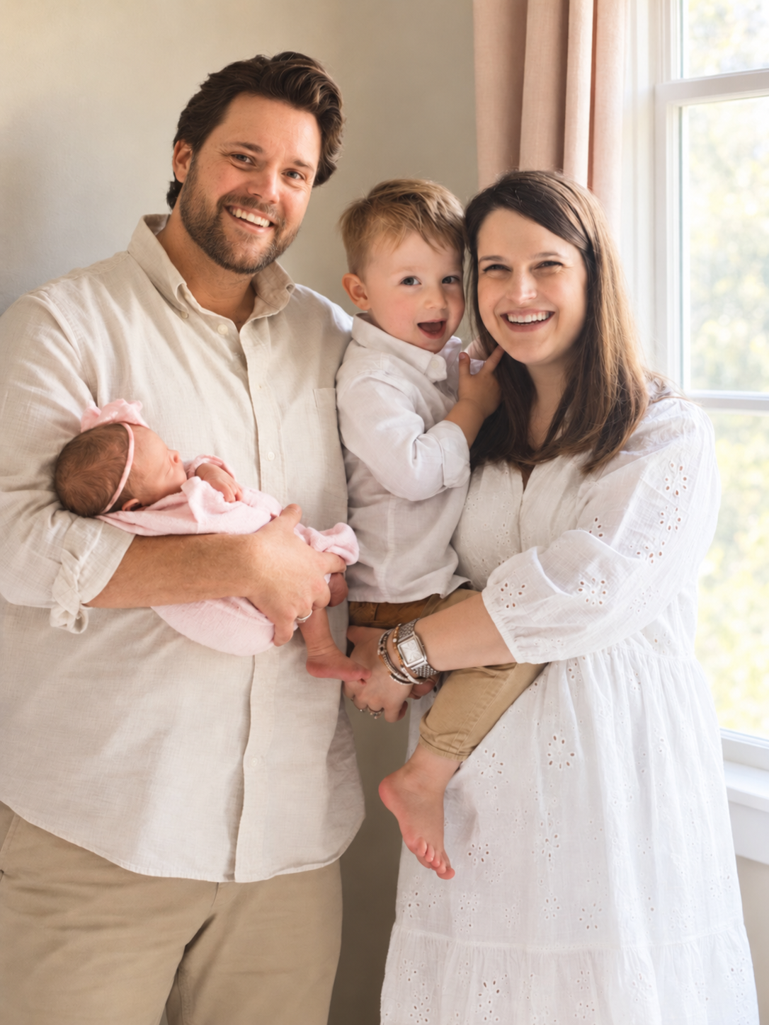 Caleb and Ali with their children, Henry and Violet, together at home